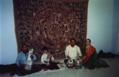 L to R: Pandit Ramesh Misra - sarangi, Rohan Misra - sarangi, Narendra Budhakar - tabla, Janaki Patrik - Kathak. Storytelling in front of kalamkari/cloth painting depicting the epic RAMAYANA